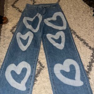 Light denim wide leg gently loved jeans w: white hearts